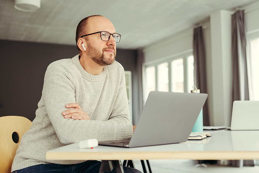 Man at laptop preparing for an interview